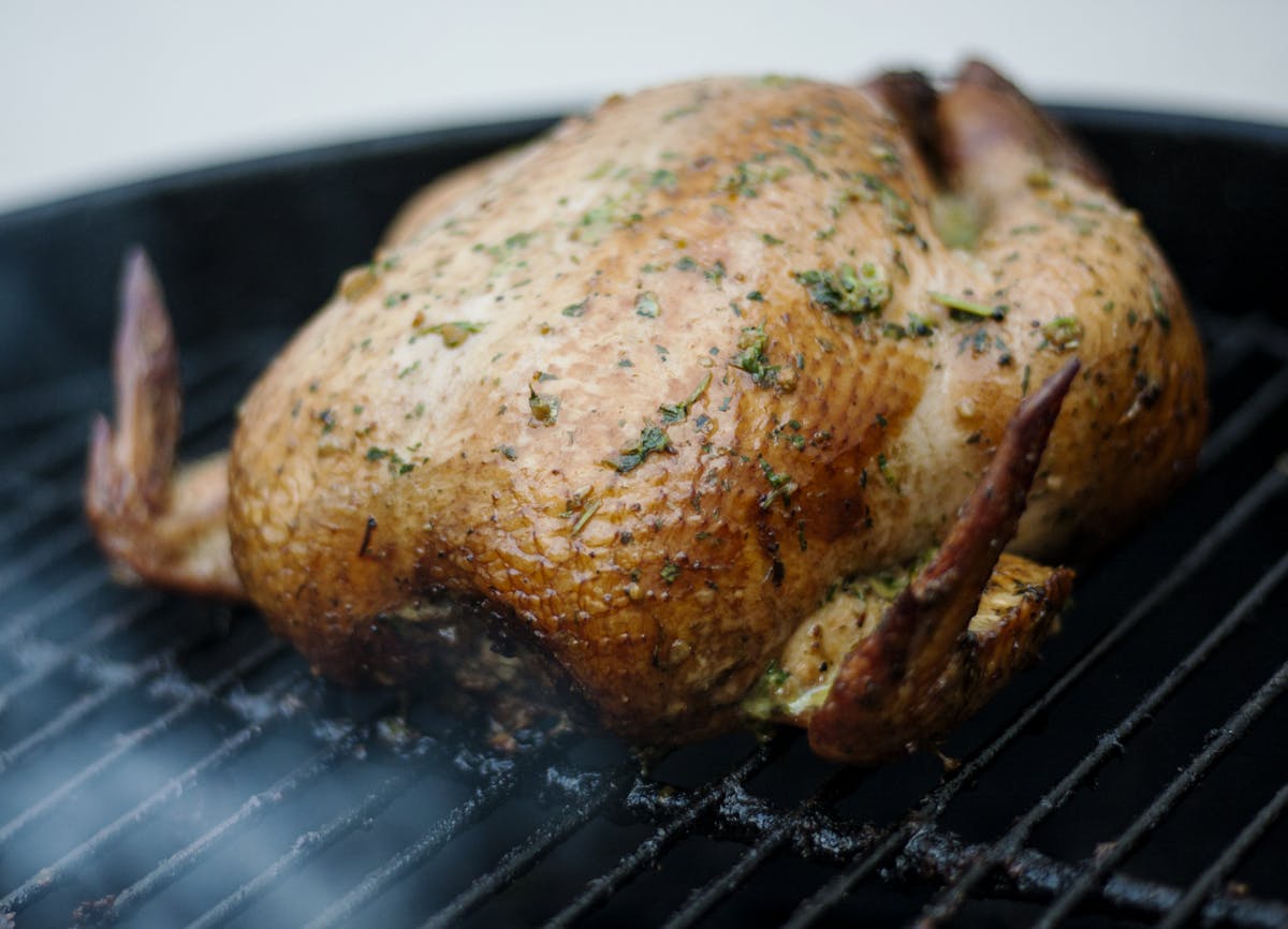 Whole smoked chicken on the grill